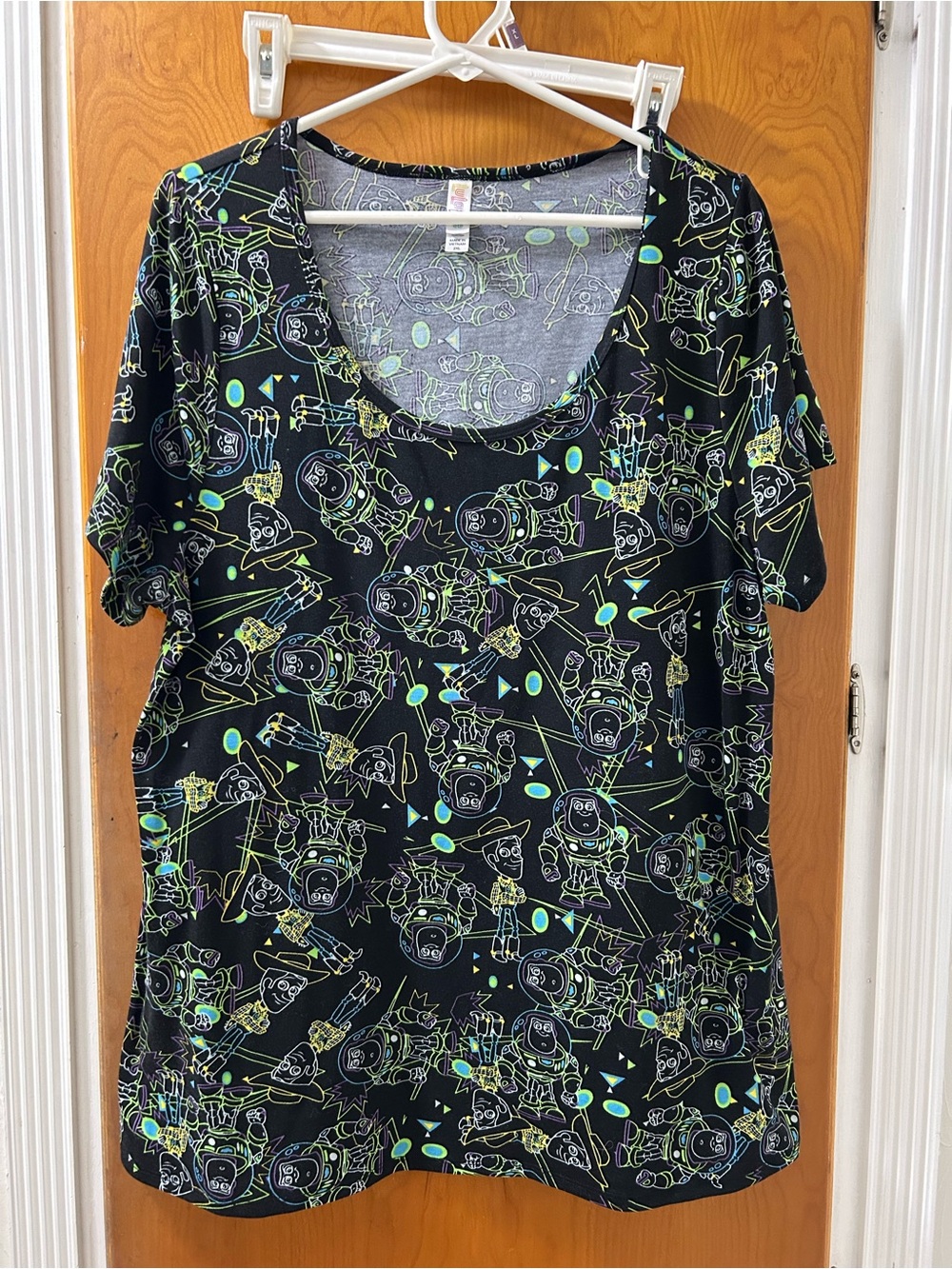 LuLaRoe Black Tee with Neon Green & Aqua Disney Toy Story Character print